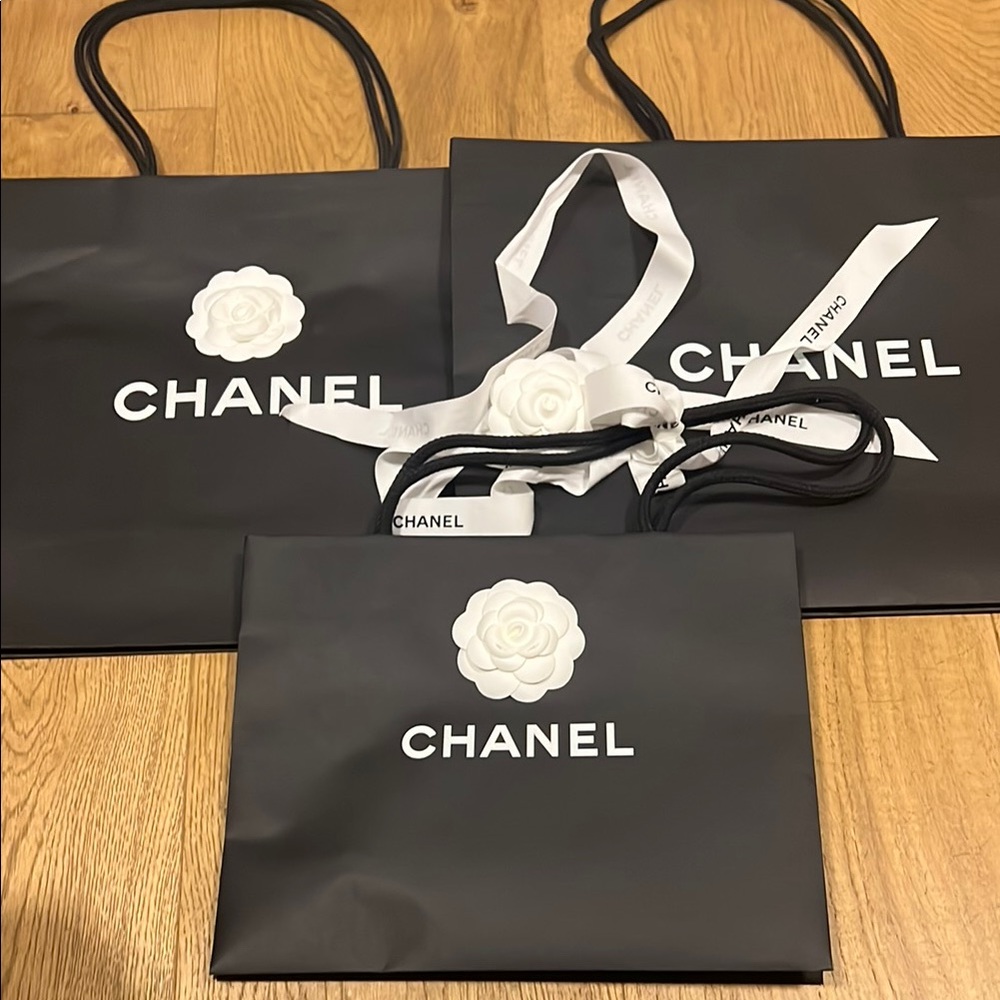 CHANEL Black Shopping Bags with White Camellia Logo and Ribbon